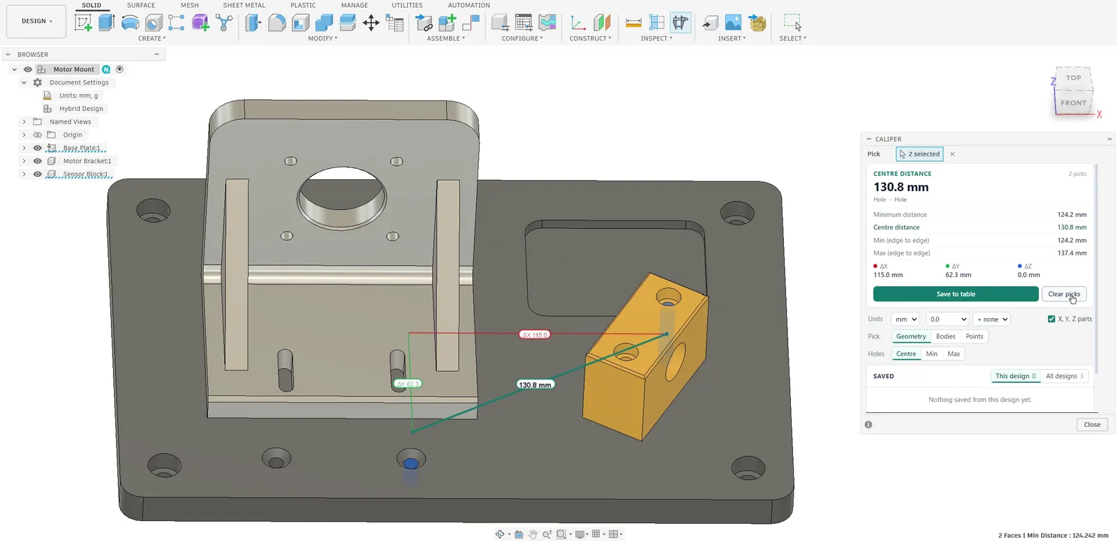 Autodesk Fusion with the Caliper dialog at the side: a motor bracket and a sensor block on a base plate, the 130.8 mm centre distance from a counterbored hole in the plate to a hole in the sensor block with its X part 115.0 in red and Y part 62.3 in green on the model, and the minimum, Min and Max edge-to-edge distances in the dialog