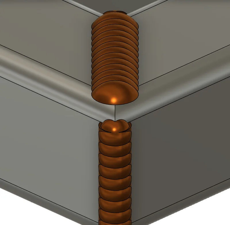 Rippled weld beads on a mitred tube corner