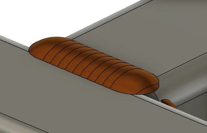Close-up of a cross rail butted against the main rail: the bead fills the groove between the square rail end and the rounded shoulder of the SHS