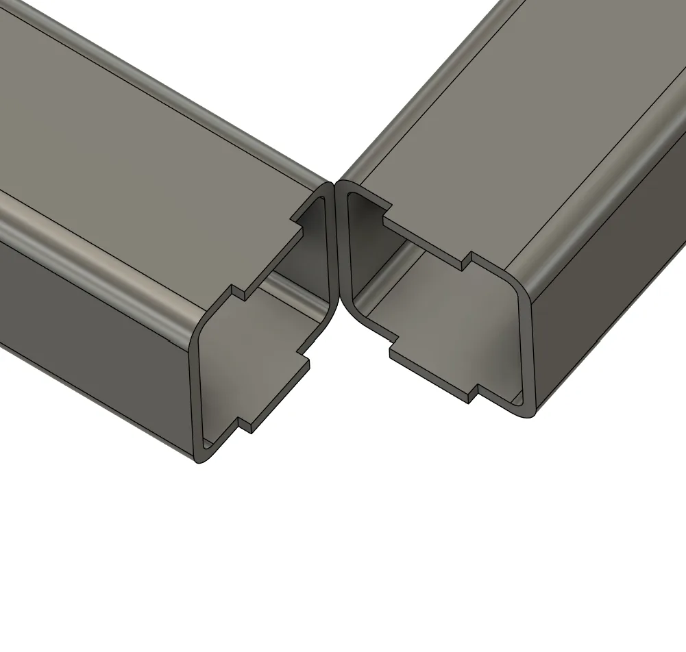 Mitred corner with a tab on each mitred end